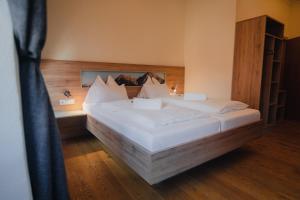 Postel nebo postele na pokoji v ubytování Hotel Restaurant DAS RÖSSL