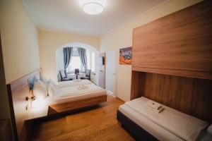 Postel nebo postele na pokoji v ubytování Hotel Restaurant DAS RÖSSL