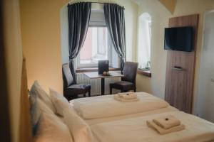 Postel nebo postele na pokoji v ubytování Hotel Restaurant DAS RÖSSL