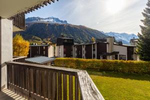 a view from the balcony of a building with mountains in the background at Résidence Coeur d'Argentière 103 Happy Rentals in Chamonix