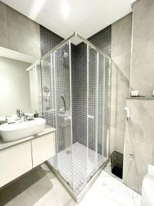 a bathroom with a shower and a sink at Glorystar 2Six2 Florida Road in Durban