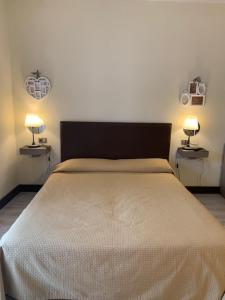 A bed or beds in a room at Il Ghetto Farm Holiday
