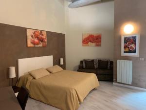 A bed or beds in a room at Il Ghetto Farm Holiday