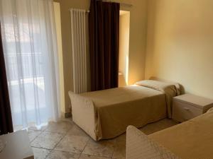 A bed or beds in a room at Il Ghetto Farm Holiday