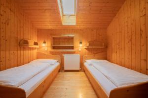 Ein Bett oder Betten in einem Zimmer der Unterkunft Lari Fari