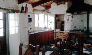 Kuchyň nebo kuchyňský kout v ubytování Descanso Reparador