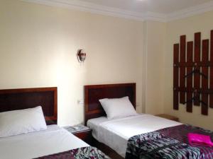 Vuode tai vuoteita majoituspaikassa Giza Pyramids View Guest house