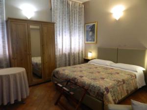 Postel nebo postele na pokoji v ubytování Osteria San Giuseppe
