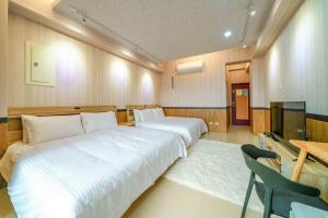 Voodi või voodid majutusasutuse 鼎愛溫泉行館 toas