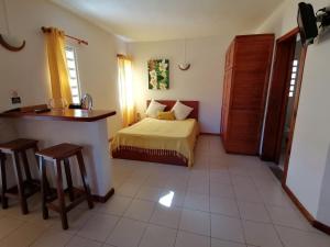 Postel nebo postele na pokoji v ubytování Terre et Mer - Studios - Ile Maurice