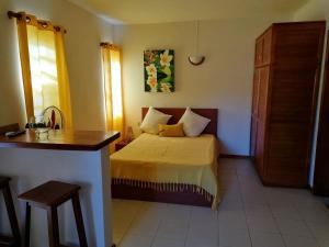 Postel nebo postele na pokoji v ubytování Terre et Mer - Studios - Ile Maurice