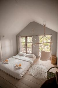 Postel nebo postele na pokoji v ubytování Cozy Huts