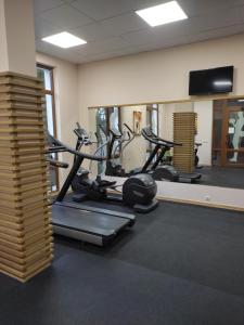 a gym with several tread machines in a room at Prestige Fort Beach Private Apartment-Studio 46 in Sveti Vlas