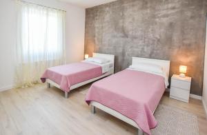 Posteľ alebo postele v izbe v ubytovaní Kuća za odmor Lucija