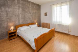 Posteľ alebo postele v izbe v ubytovaní Kuća za odmor Lucija