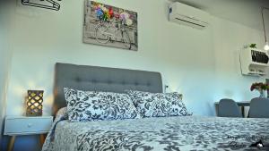 A bed or beds in a room at Alojamiento Rural Tetuán