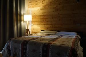 Letto o letti in una camera di Alpi Azzurre