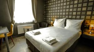 Postel nebo postele na pokoji v ubytování DUA Hotel