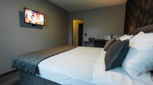 Postel nebo postele na pokoji v ubytování DUA Hotel