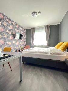Postel nebo postele na pokoji v ubytování DUA Hotel