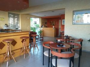 A restaurant or other place to eat at Zannis Hotel