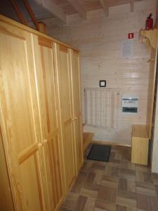 a room with a wooden door and a floor at Agroturystyka nad Morzem in Ustka