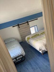 Кровать или кровати в номере Appartement loft toit/terrasse