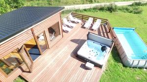 an overhead view of a deck with a swimming pool at Mana Village - Jacuzzi & Sauna in Barłomino