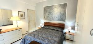A bed or beds in a room at COMODO AL MARE
