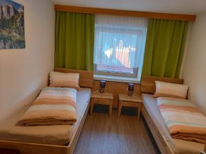 Postel nebo postele na pokoji v ubytování Ferienwohnung Regensburger + 9 fotografií