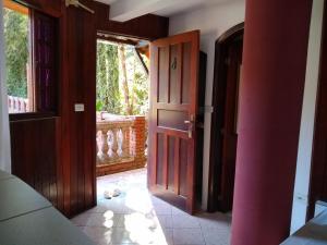 an open door to a room with a porch at Hotel Serra De Penedo in Penedo