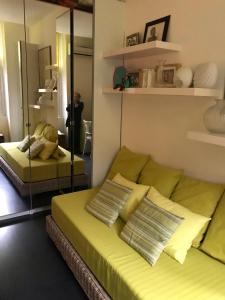 a living room with two beds and a couch at Chambre 1 personne avec terrasse centre ville Marseille 3 nuits min , femme uniquement in Marseille