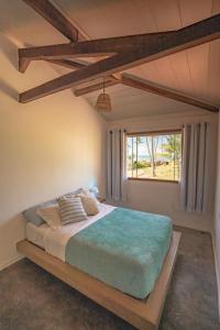 Säng eller sängar i ett rum på Welove Beach House-Pés na areia Quintal dos Sonhos