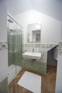 a bathroom with a sink and a shower at Podere Sant'Antonio da Zio Gino in Bolsena