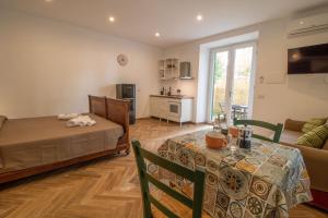 a bedroom with a bed and a table and a couch at Podere Sant'Antonio da Zio Gino in Bolsena +8 photos