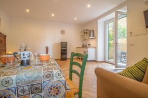 a living room with a table and a kitchen at Podere Sant'Antonio da Zio Gino in Bolsena