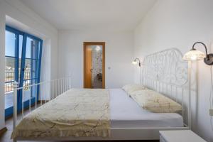 Posteľ alebo postele v izbe v ubytovaní Villa Lapida