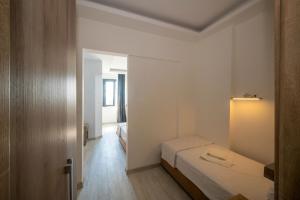 A bed or beds in a room at Okda Hotel