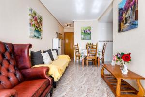 a living room with a couch and a table at Apartament Caballero de Rodas in Torrevieja +40 photos