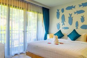 Postel nebo postele na pokoji v ubytování Golden Paradise Hotel - SHA PLUS