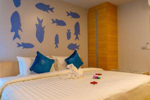 Postel nebo postele na pokoji v ubytování Golden Paradise Hotel - SHA PLUS