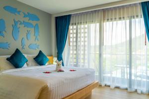 Postel nebo postele na pokoji v ubytování Golden Paradise Hotel - SHA PLUS