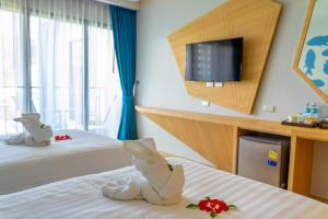Postel nebo postele na pokoji v ubytování Golden Paradise Hotel - SHA PLUS