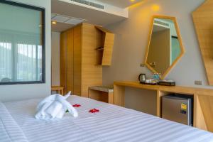 Postel nebo postele na pokoji v ubytování Golden Paradise Hotel - SHA PLUS