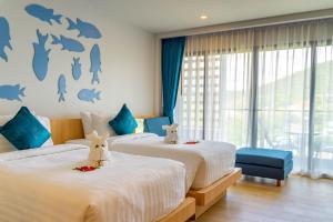 Postel nebo postele na pokoji v ubytování Golden Paradise Hotel - SHA PLUS