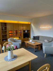 a living room with a couch and a table at Ferienhaus Freitag in Kurort Oberwiesenthal
