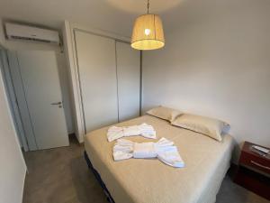 A bed or beds in a room at La Escondida Salta 5