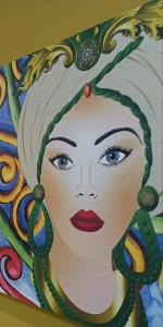 una pintura de una mujer con lápiz labial rojo en A Cantunera LittleHouse en Agrigento