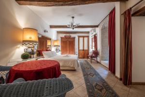 A bed or beds in a room at Corte Cristina & Suites