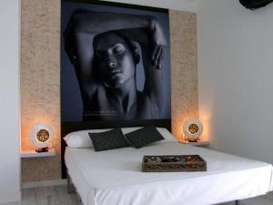 Postel nebo postele na pokoji v ubytování Hotel Muva Beach